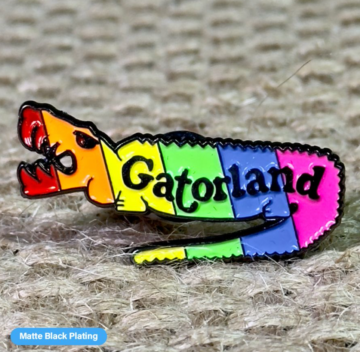 Close-up of a Pinlord.com manufacturer lapel pin with "Now Review" design on a white background.