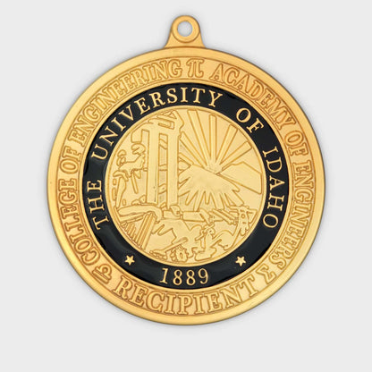 Close-up of a Medalcraft Mint manufacturer medal with detailed craftsmanship and a shiny gold finish.