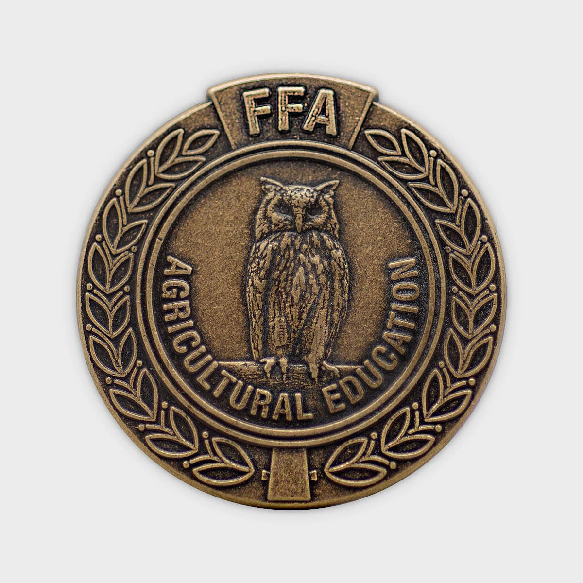 Close-up of a custom Medalcraft Mint pin featuring detailed engraving and vibrant colors, showcasing quality craftsmanship.