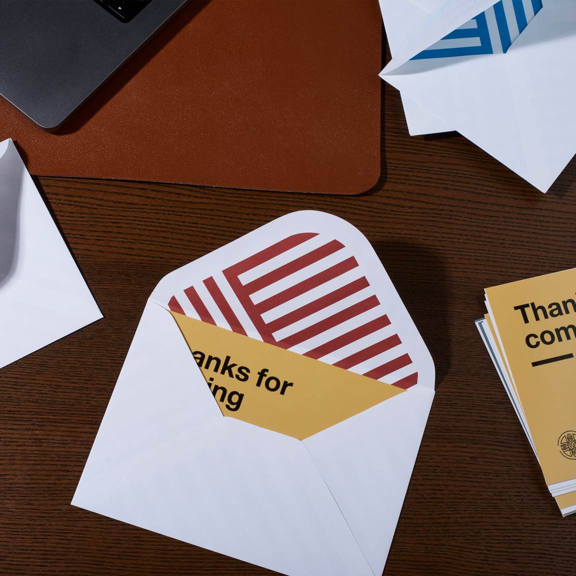 Custom envelope from Pinlord.com featuring the MOO Review manufacturer branding and sleek, professional design.