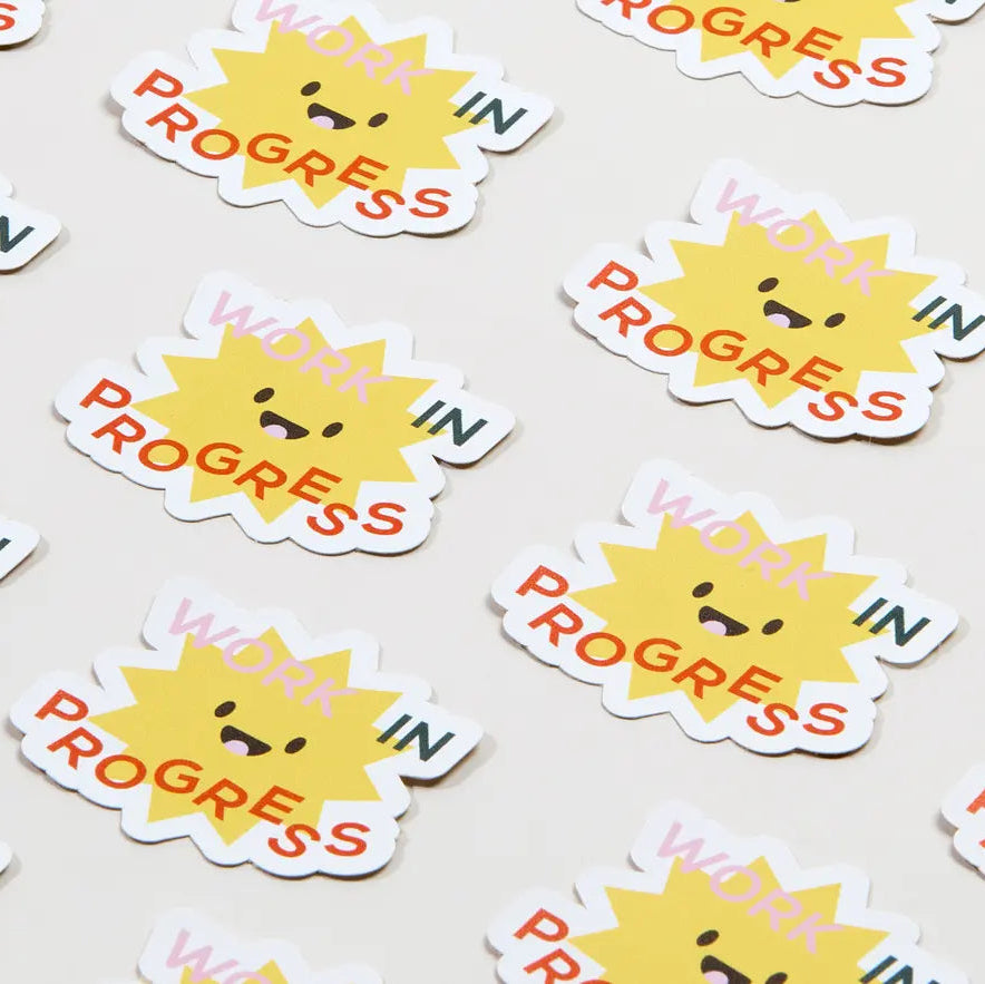 Colorful MOO Review stickers from Pinlord.com, featuring vibrant designs and branding on a glossy surface.