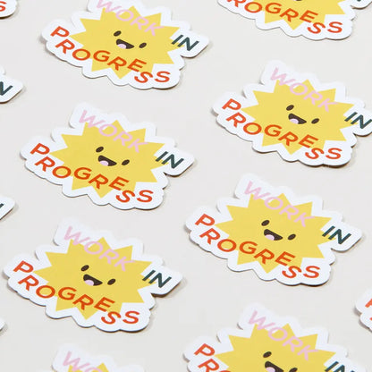 Colorful MOO Review stickers from Pinlord.com, featuring vibrant designs and branding on a glossy surface.