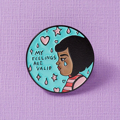 Close-up of a colorful enamel pin from Pinlord.com, featuring a punk-inspired design with intricate details and vibrant colors.