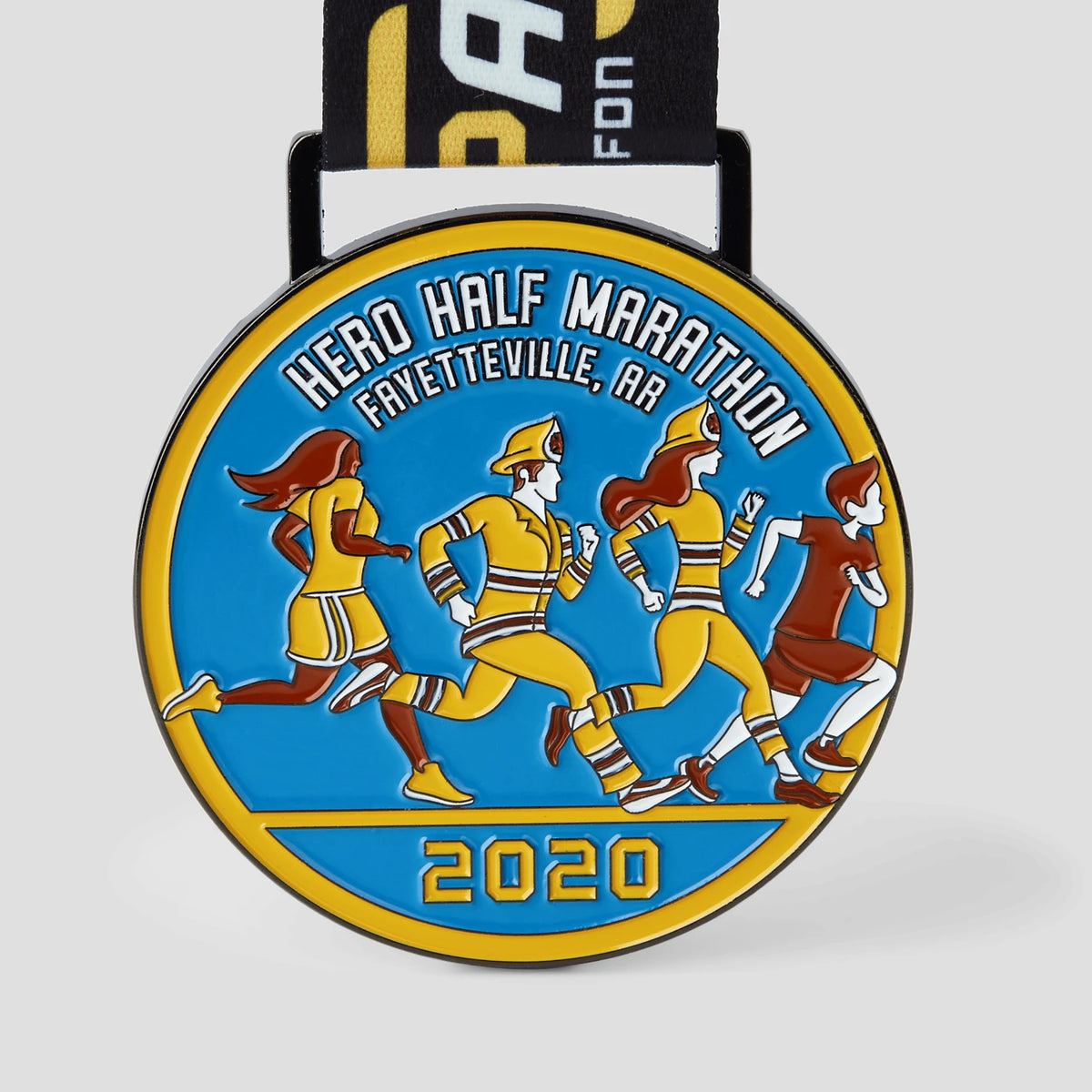 Close-up of THE/STUDIO Review medals showcasing detailed design and metallic finish, produced by Pinlord.com.