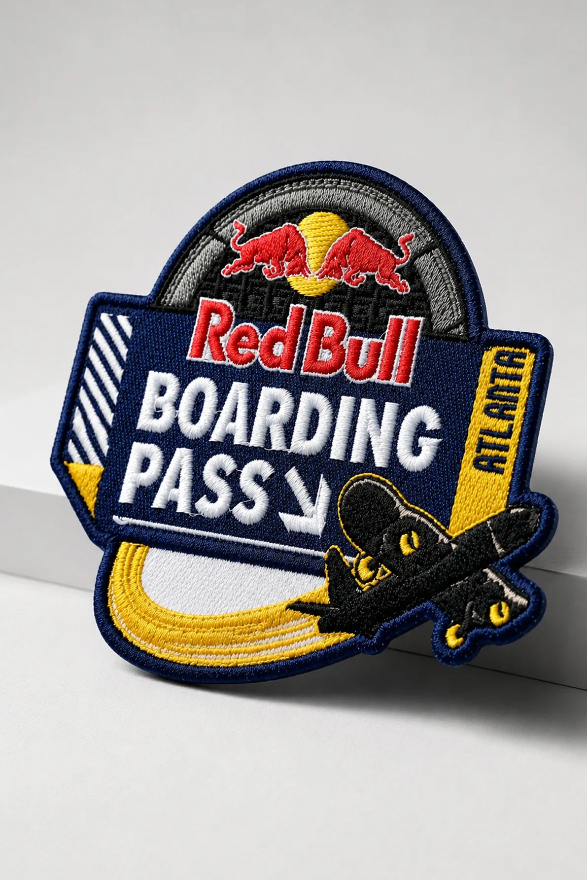Close-up of THE/STUDIO Review patch by Pinlord.com, featuring detailed design on a fabric patch with a black background.