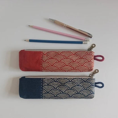 Custom pencil case from Pinlord.com featuring colorful fabric and a zipper closure, perfect for organizing stationery.