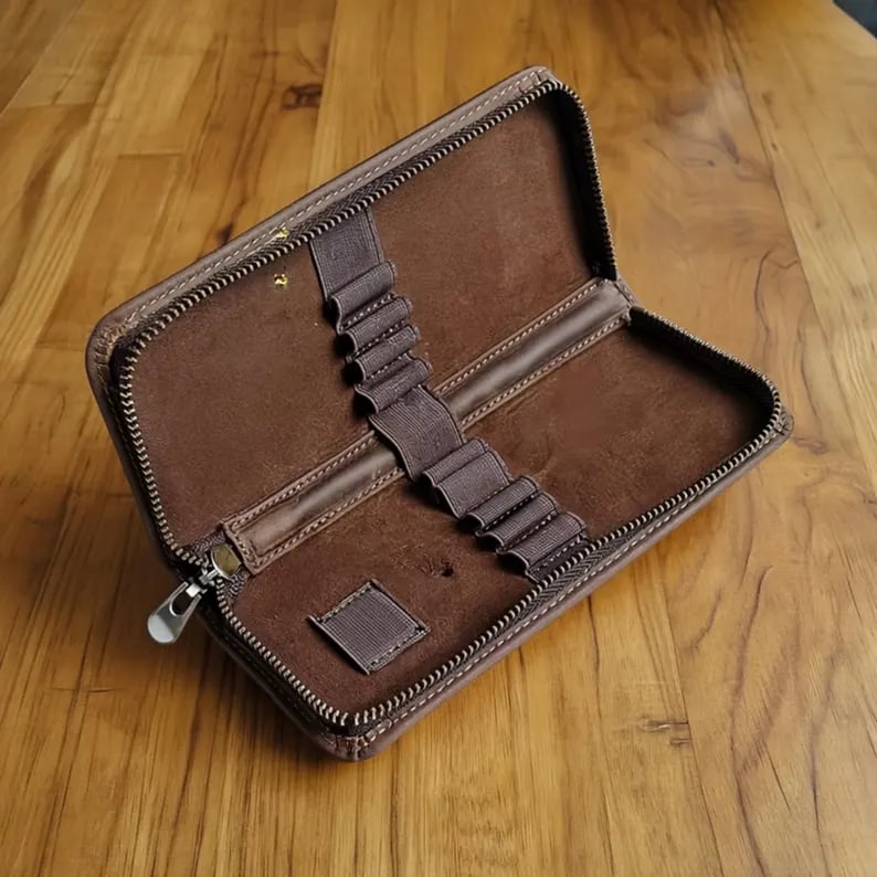 Custom pencil case by Pinlord.com with colorful fabric and zipper closure, designed for storing pens and pencils.
