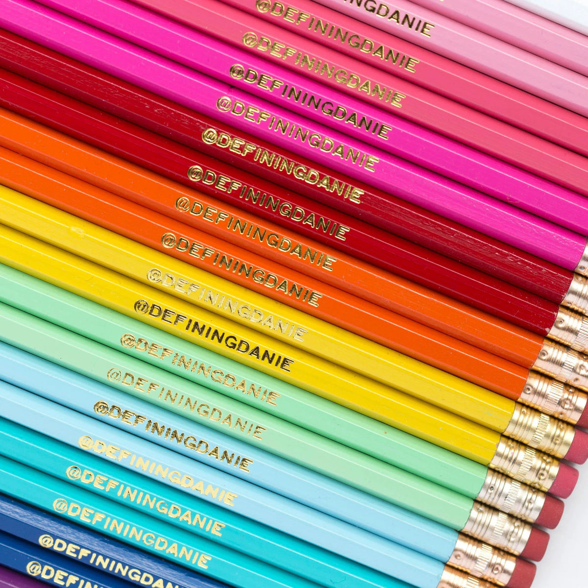 Custom Pinlord.com pencils with colorful erasers and engraved branding, perfect for writing or gifting.