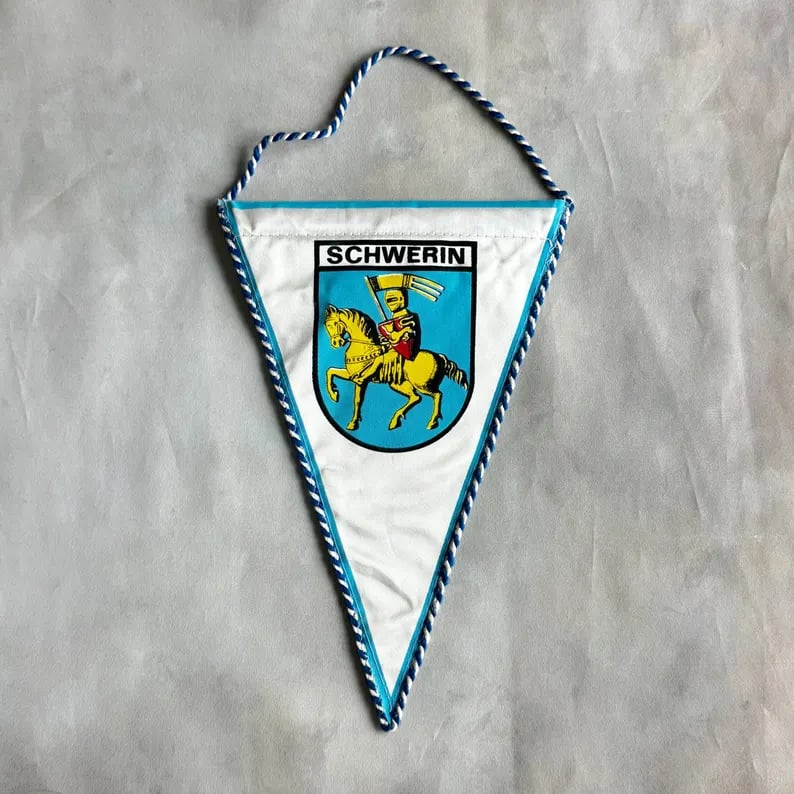 Custom Pennants featuring vibrant designs and bold lettering, perfect for personal or team celebrations.