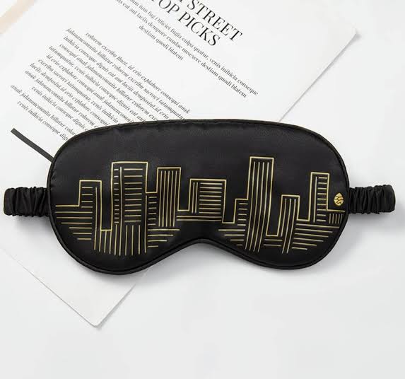 Soft black custom sleeping mask by Pinlord.com, designed to block light and provide comfortable sleep.