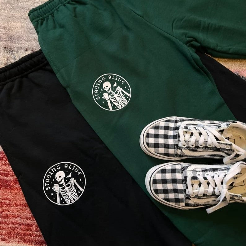 Custom sweatpants by Pinlord.com featuring personalized design, comfortable fit, and casual style, shown in a relaxed pose.