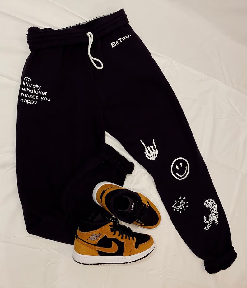 Custom sweatpants by Pinlord.com featuring a comfortable fit and personalized design, shown in a relaxed pose.