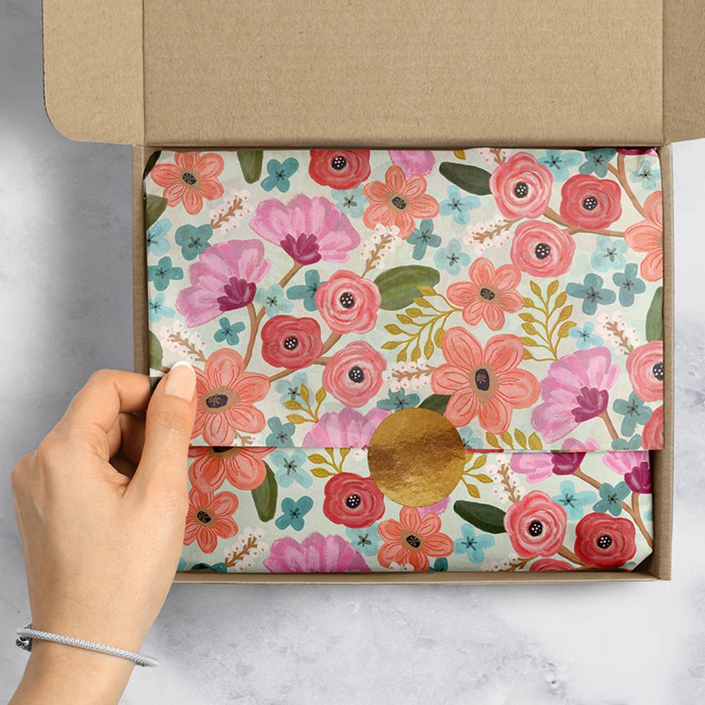 Custom tissue paper with colorful patterns, ideal for gift wrapping and packaging from Pinlord.com.