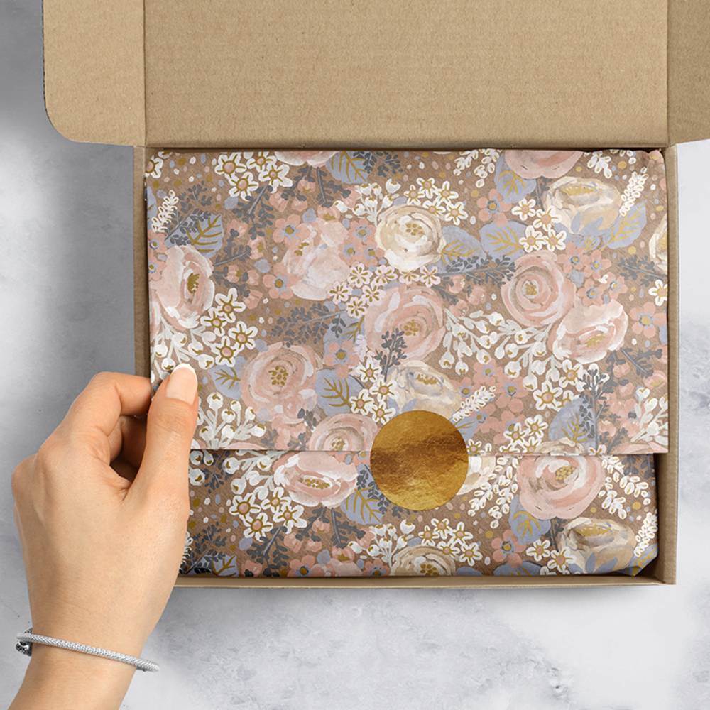 Custom tissue paper with colorful printed design, ideal for gift wrapping and packaging from Pinlord.com.