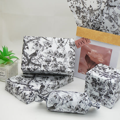 Decorative custom tissue paper with colorful patterns, ideal for gift wrapping and packaging by Pinlord.com.