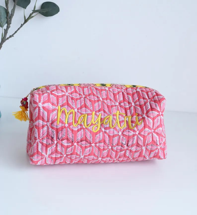 Custom toiletry bag from Pinlord.com with multiple compartments, made of durable fabric, designed for travel organization.