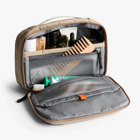 Custom toiletry bag design template with optional personalization, featuring a sleek, organized layout for travel essentials by Pinlord.com.