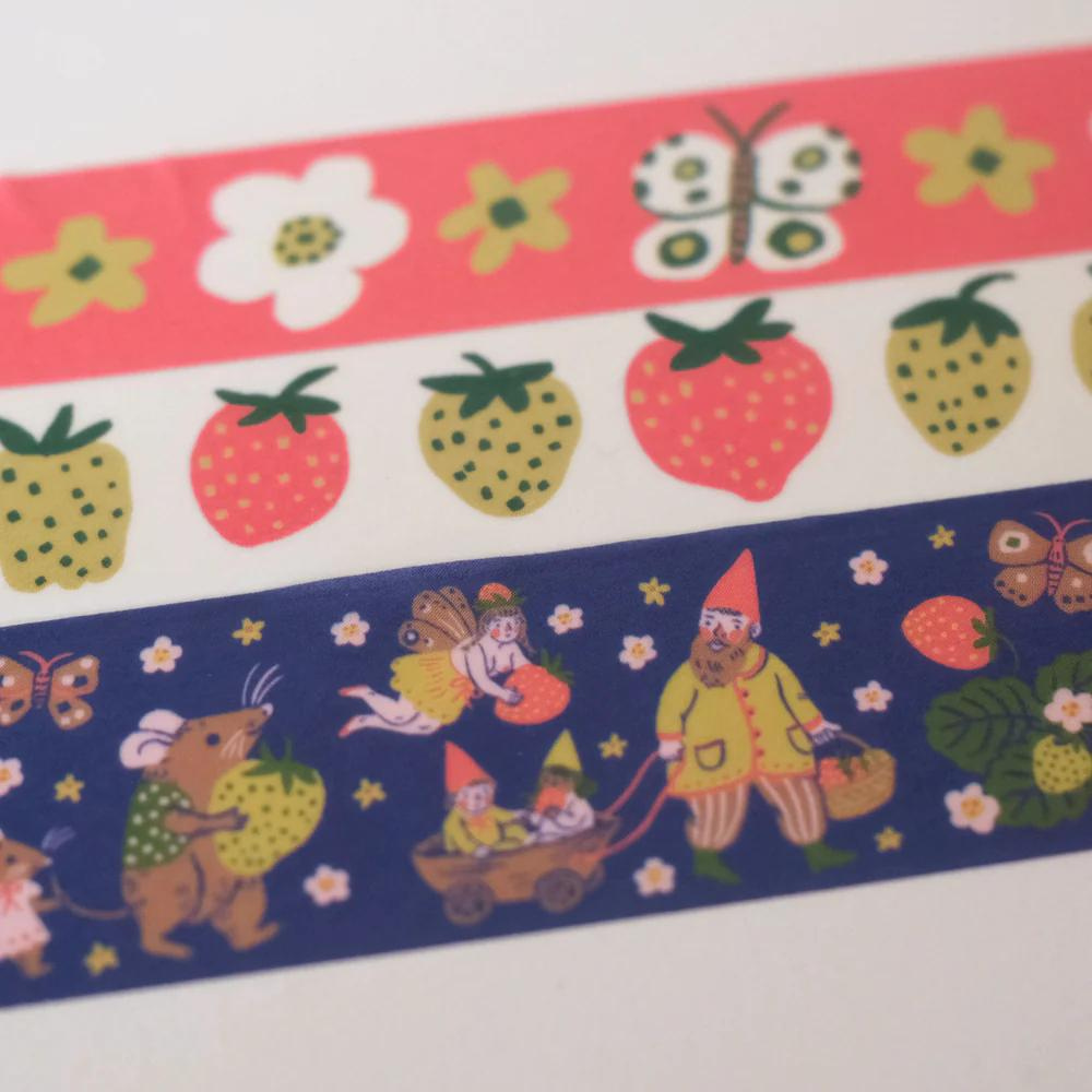 Custom Washi Tape by Pinlord.com featuring colorful, patterned designs on a roll of decorative adhesive tape.