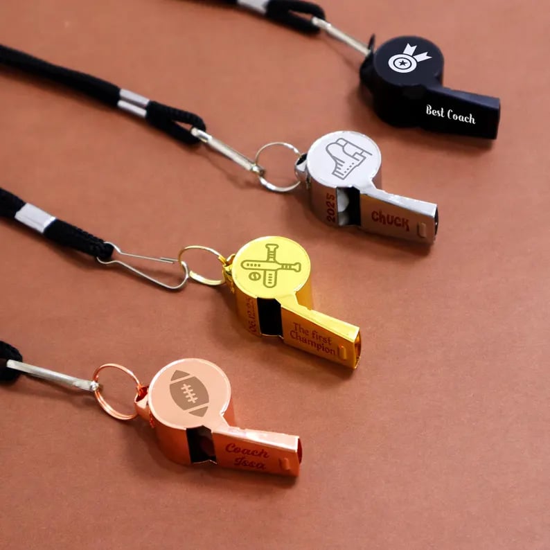 Custom Pinlord.com whistle with engraved design, featuring a sleek metal body and a functional mouthpiece for easy use.
