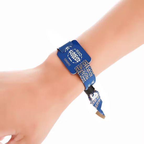 Custom wristbands from Pinlord.com featuring personalized designs on sturdy fabric wristbands.